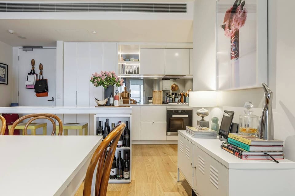 The apartment's interior matches the trendy and artsy location of Collingwood, complete with plenty of art, small touches and reading materials for your stay