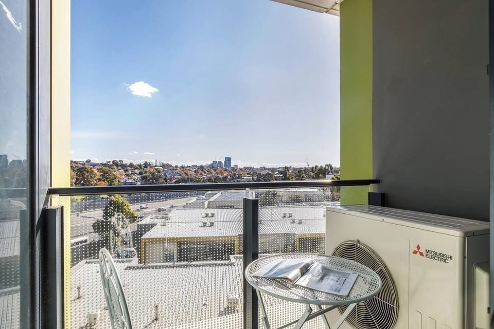 Enjoy slow mornings on the covered balcony with coffee in hand and overlooking city views.

