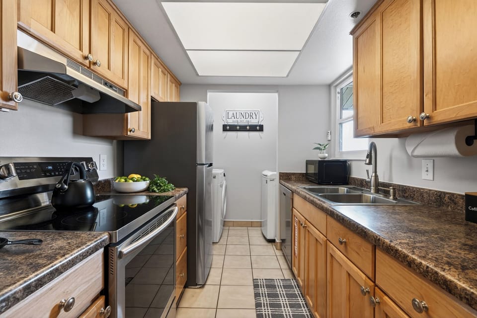 Kitchen showing wooden cabinetry and modern appliances.