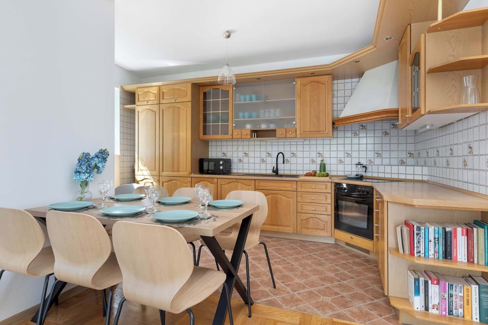 The sleek design of the kitchenette blending seamlessly with the living area.