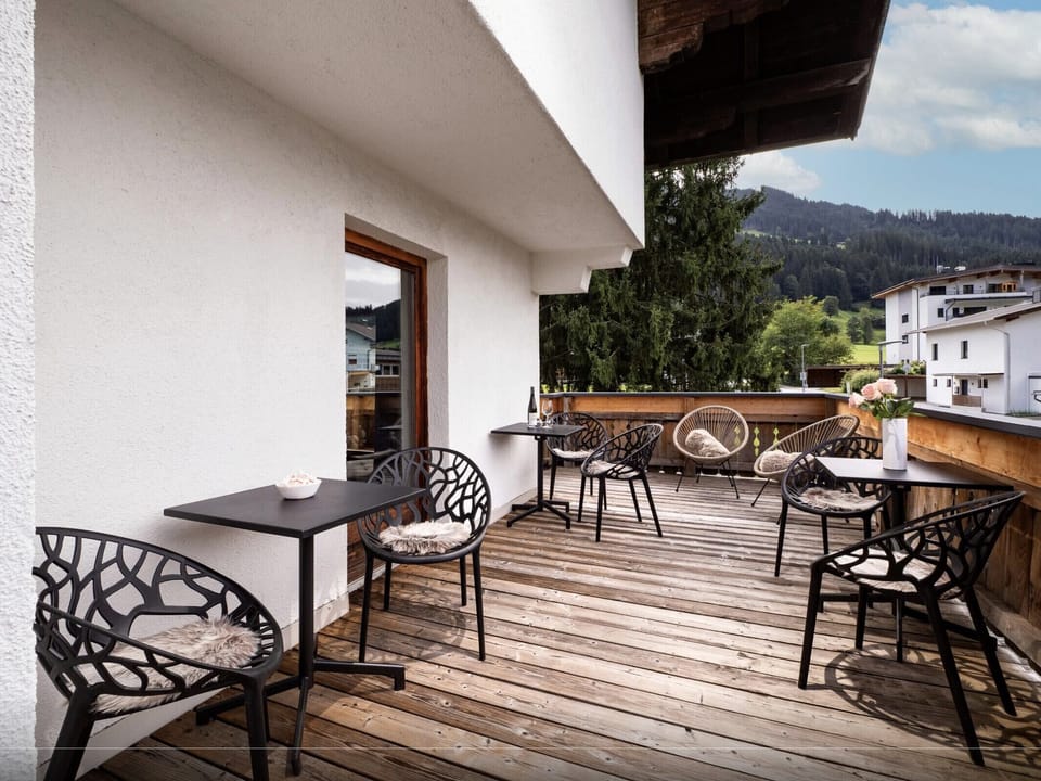 Westendorf vacation apartment with balcony seating, quiet Bichling setting and easy access to the village center, ski bus and Alpine trails.