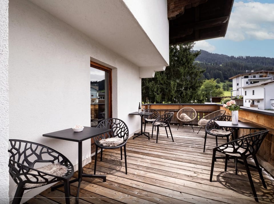 Westendorf vacation apartment with furnished balcony, Alpine views and a quiet Bichling setting close to the village center, ski bus and trails.