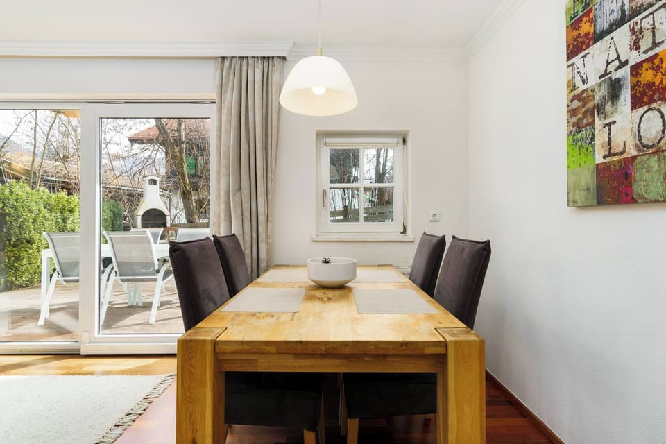 Book a vacation apartment in Kitzbühel with bright dining area, garden access, patio, quality interiors and central location near the ski lift.