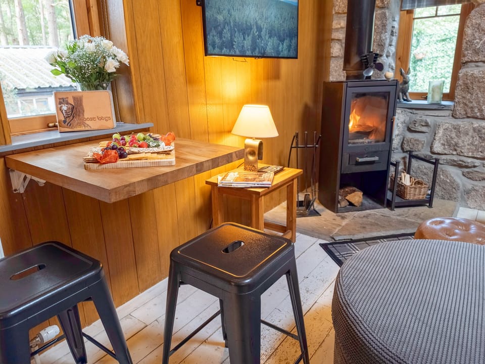 Pull up a stool at the breakfast bar with the stove lit and the woods just outside the window. It tends to be the spot you sit at far longer than you meant to.