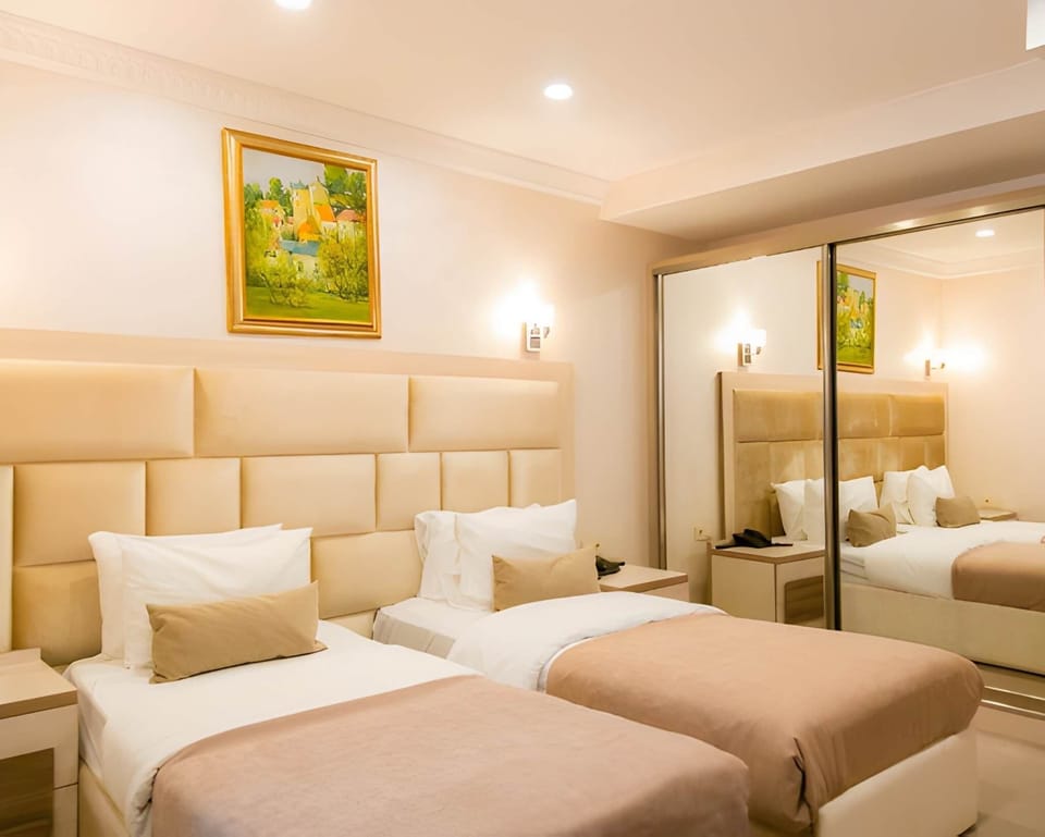 Standard Double Room, City View | Iron/ironing board, WiFi (free), bed sheets