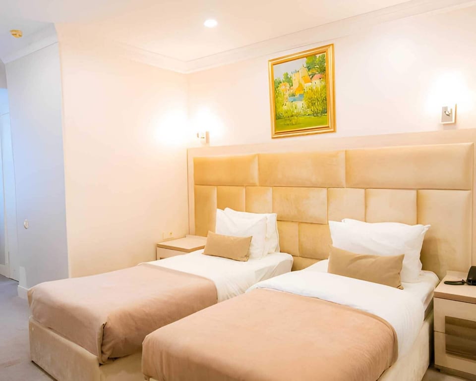 Standard Double Room, City View | Iron/ironing board, WiFi (free), bed sheets