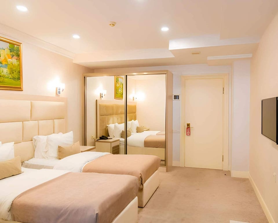 Standard Double Room, City View | Iron/ironing board, WiFi (free), bed sheets