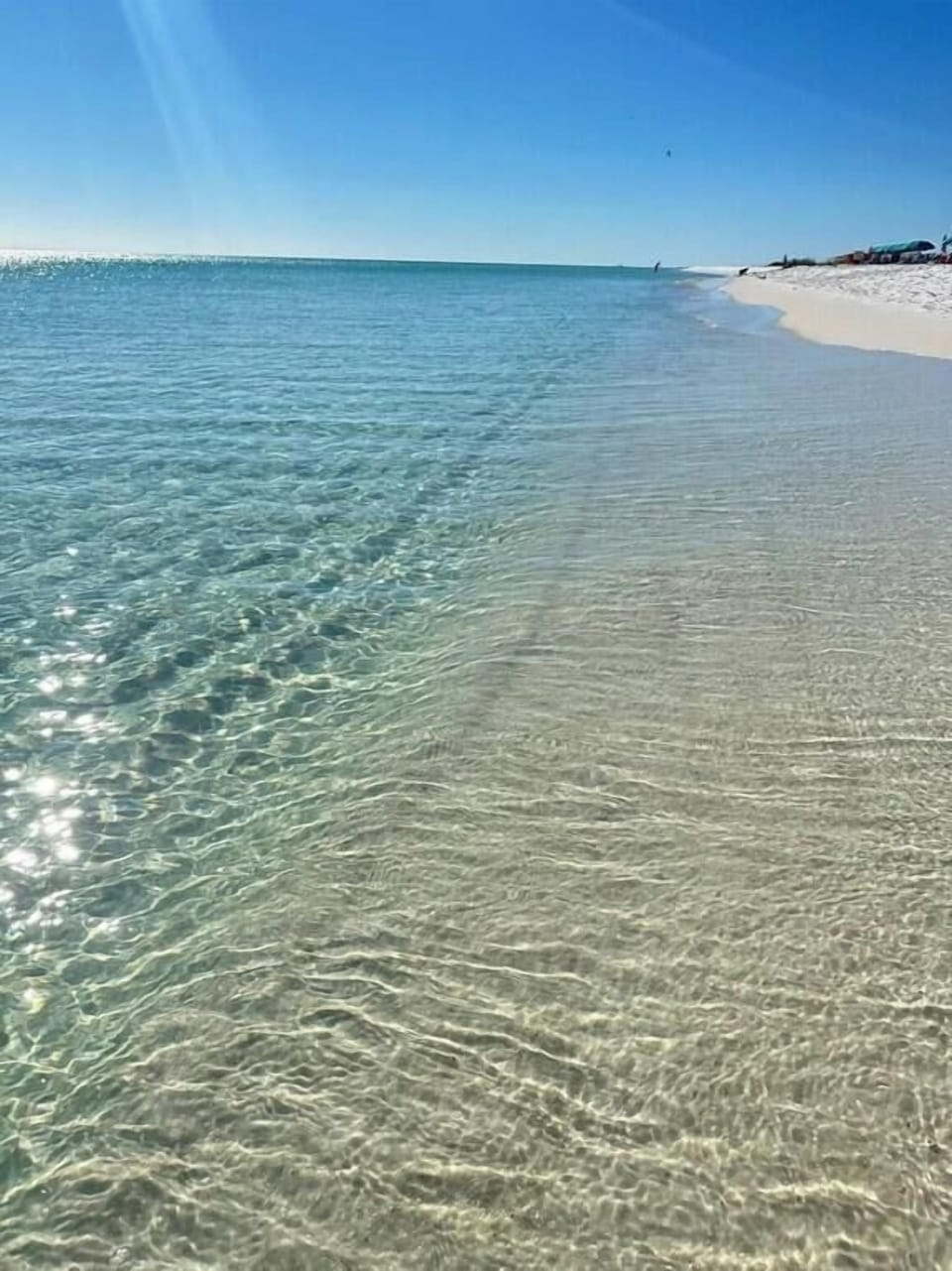 Experience the breathtaking beauty of Okaloosa Island's world-famous emerald-green waters and powder-soft white sand—perfect for swimming, shell hunting, and relaxing in the Florida sunshine.