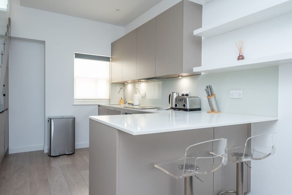 Contemporary kitchen island with breakfast bar seating for two