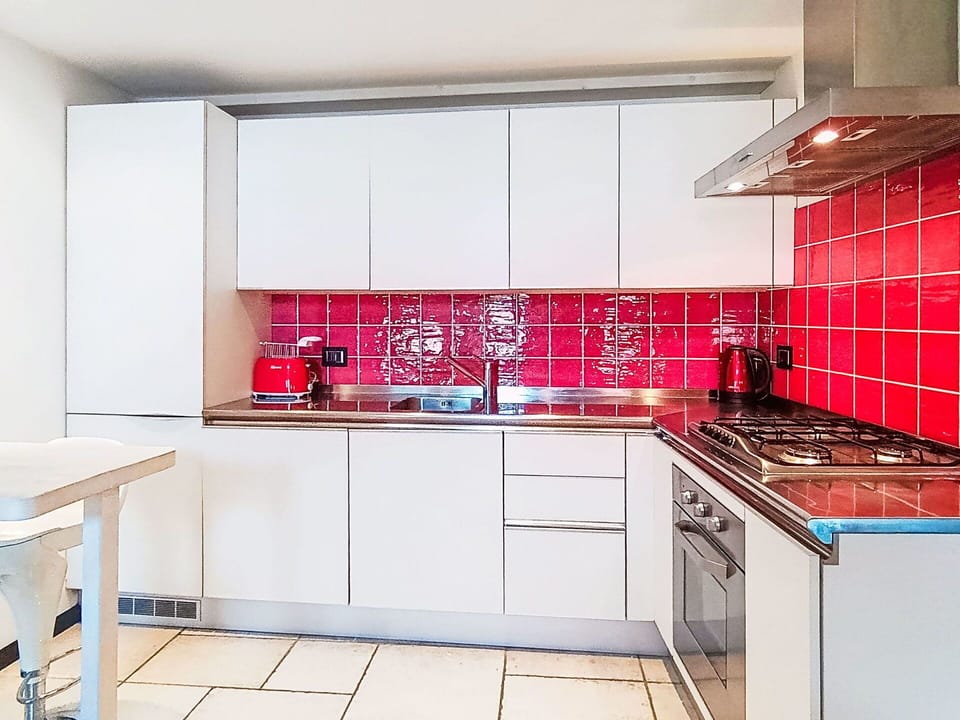 Kitchen, Kitchen Appliance, Major Appliance, Countertop, Flooring, Interior Design, Floor, Kitchen Stove, Cabinetry, Tile