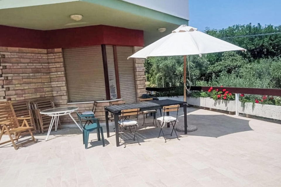 Furniture, Flooring, Outdoor Furniture, Floor, Chair, Composite Material, Outdoor Table, Shade, Umbrella, Flagstone