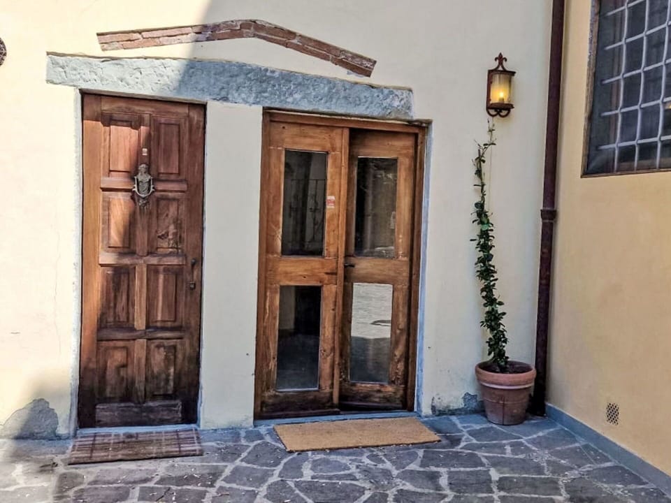 Wall, Wood, Door, Home Door, Floor, Hardwood, Wood Stain, Concrete, Door Handle, Flowerpot
