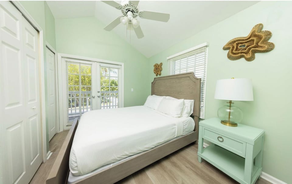 Relax in a tranquil bedroom with soft light and airflow.