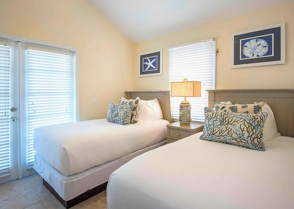 Unwind in crisp twin beds after sun-soaked adventures.