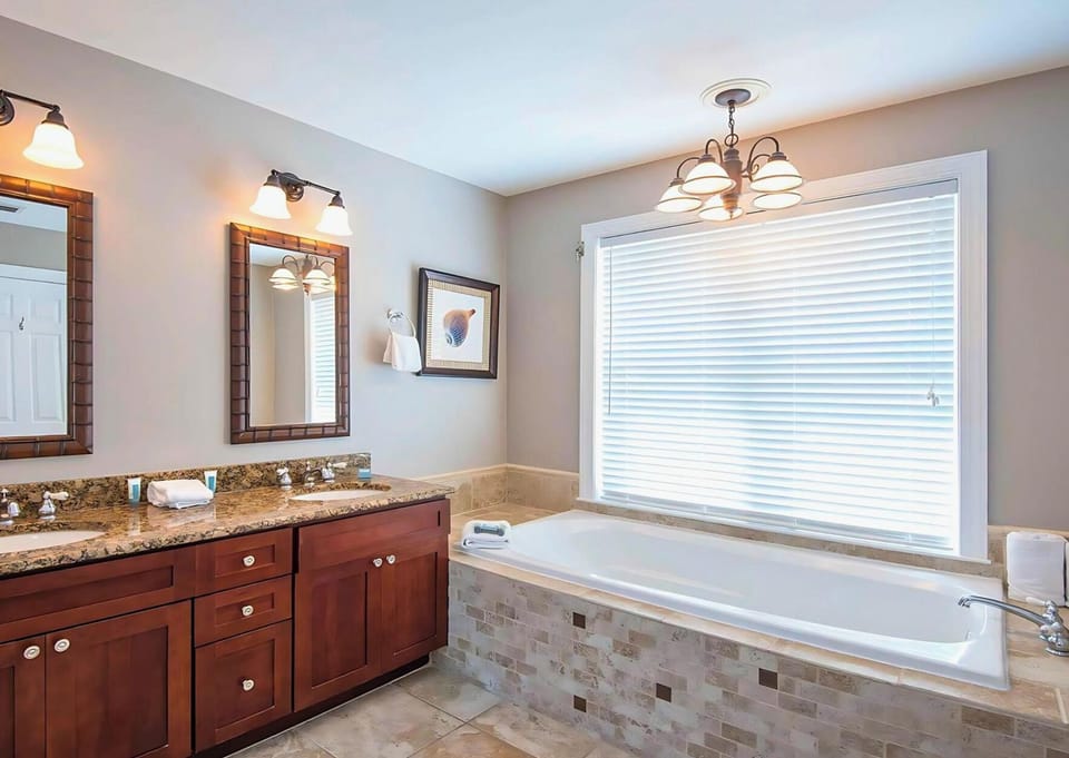 Soak and relax in the spacious tub after beach days.