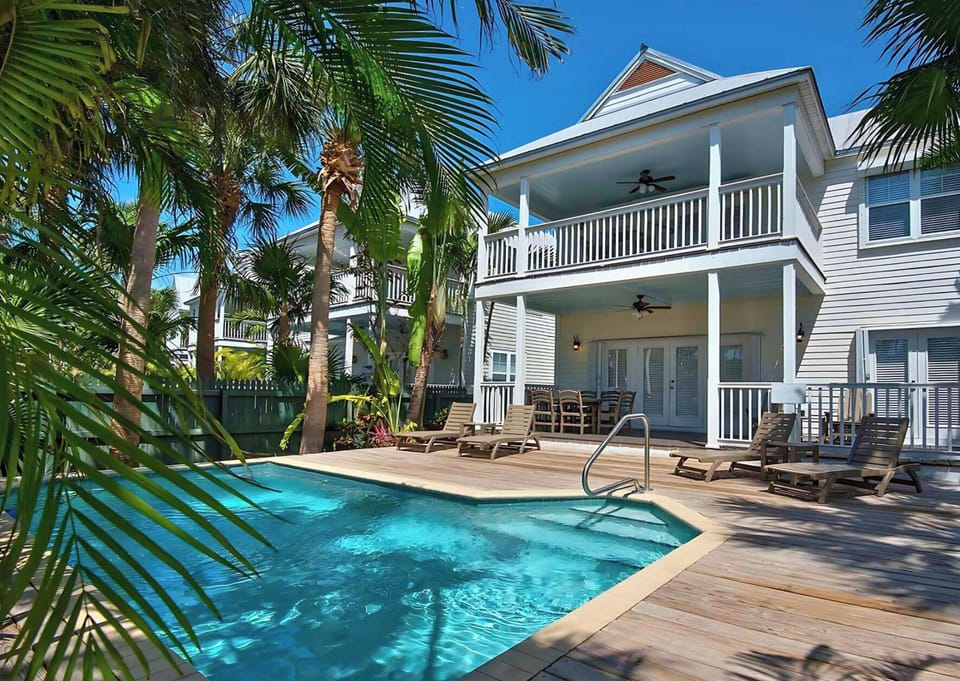 Dive into the sparkling pool and lounge under palms.