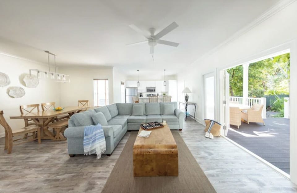 Gather on the spacious sectional in a sunlit open-plan lounge.