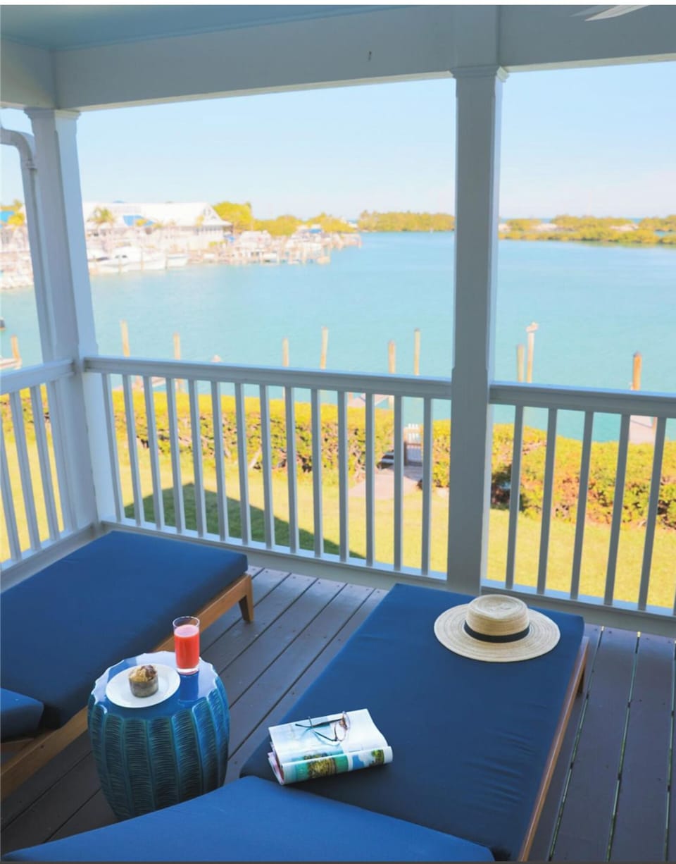 Sip morning coffee on the breezy balcony overlooking the bay.
