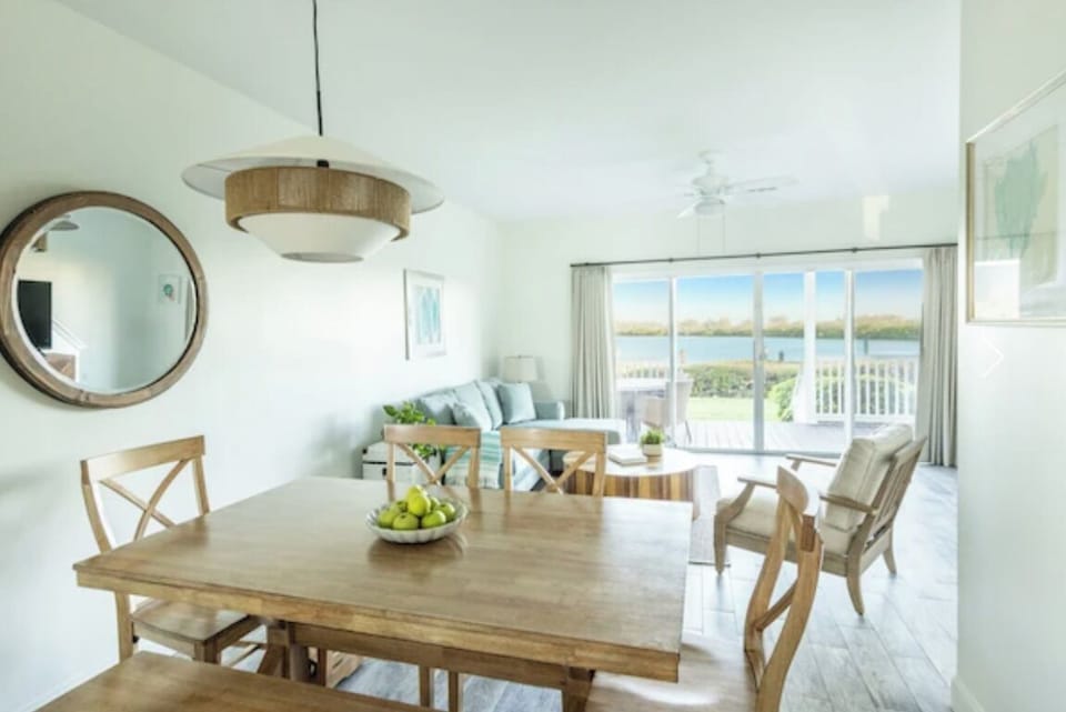 Enjoy relaxed meals at the dining table with coastal light.