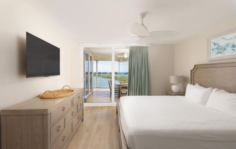 Drift off in a calm bedroom with private terrace access.