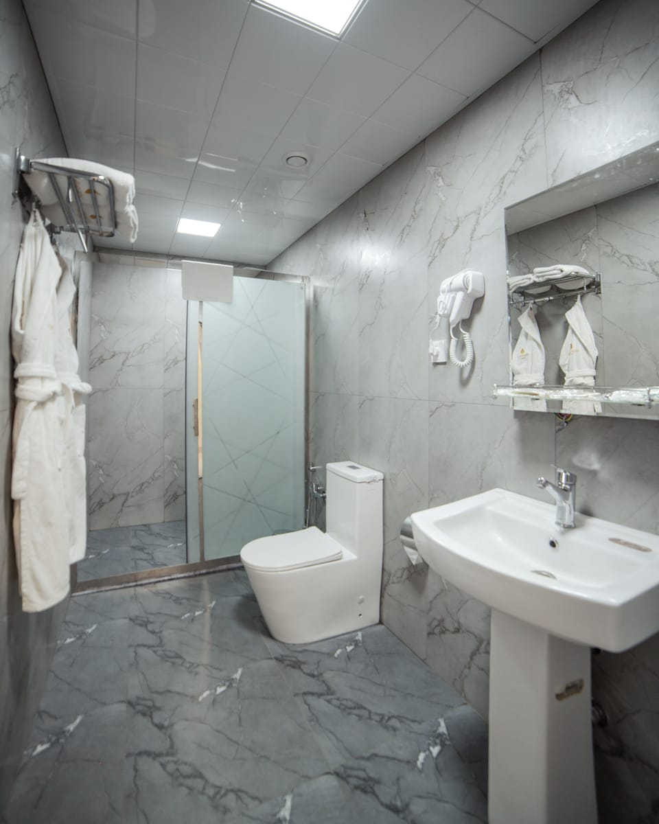 Shower, free toiletries, hair dryer, slippers