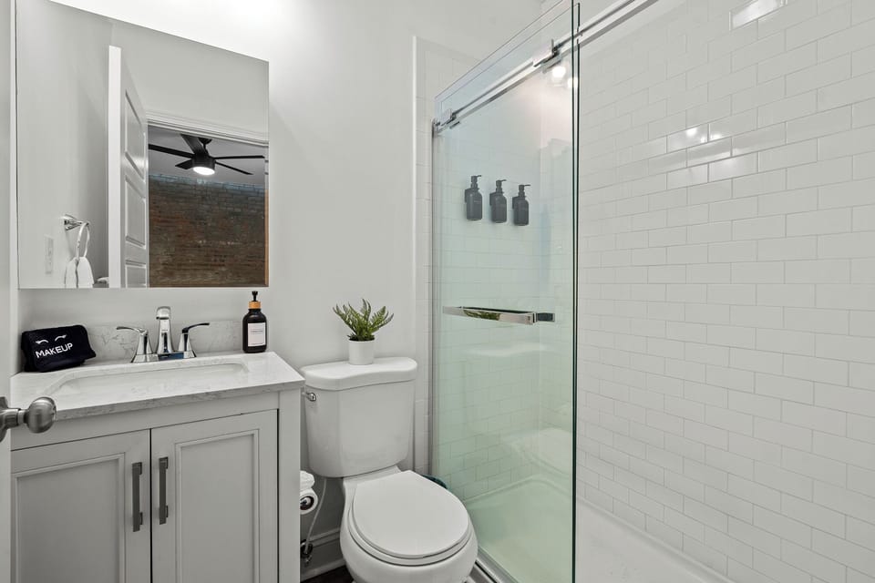Modern Bathroom: Glass walk-in shower and sleek vanity!