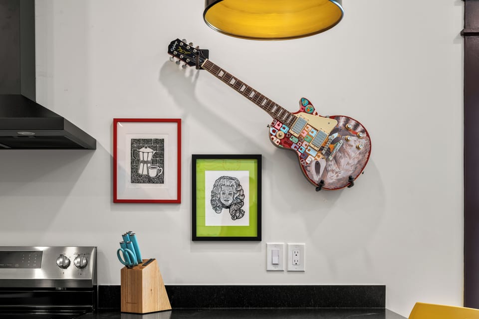 Art-filled modern kitchen with bold decor and creative boutique style