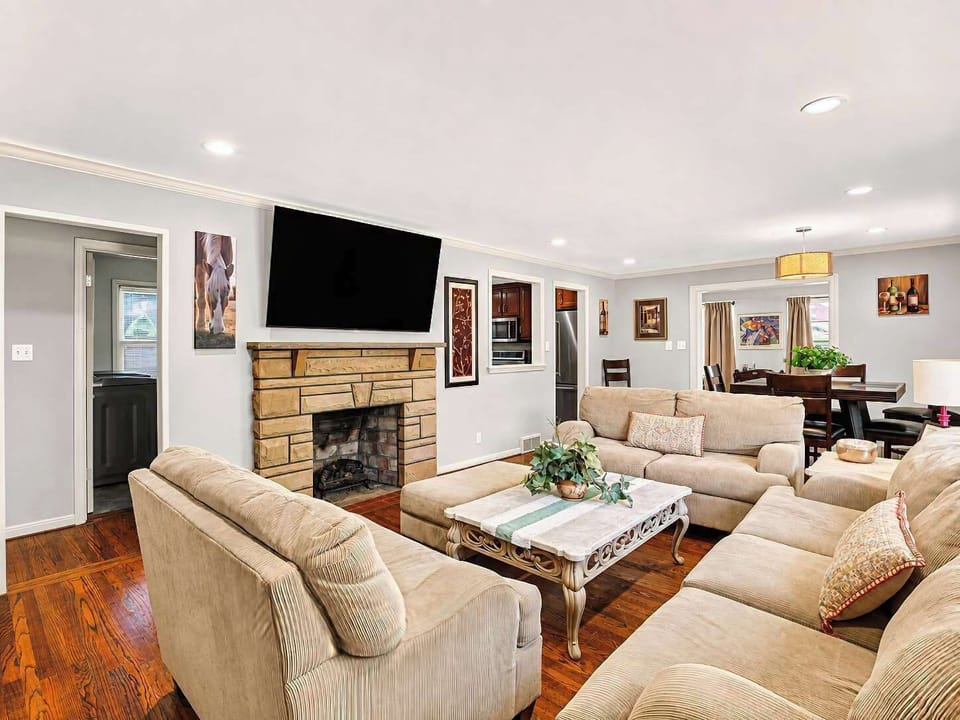 A spacious living room made for movie nights, board games and easy conversation with 70" smart TV
