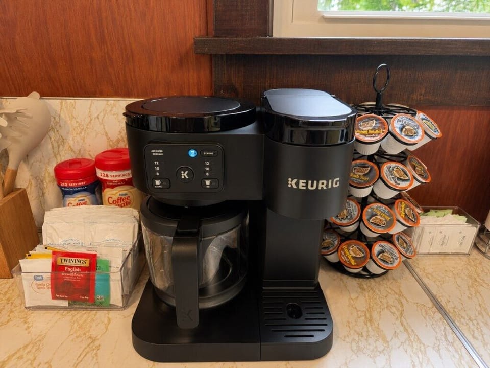 Coffee station with a Keurig, K-Cups, sugar, and everything you need for your morning coffee.