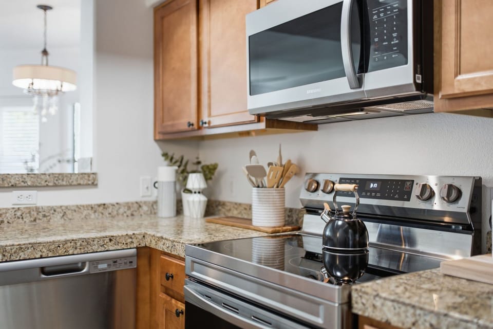 Cook up a feast in the well-appointed kitchen, featuring granite counters, stainless appliances, and a Keurig for easy mornings.