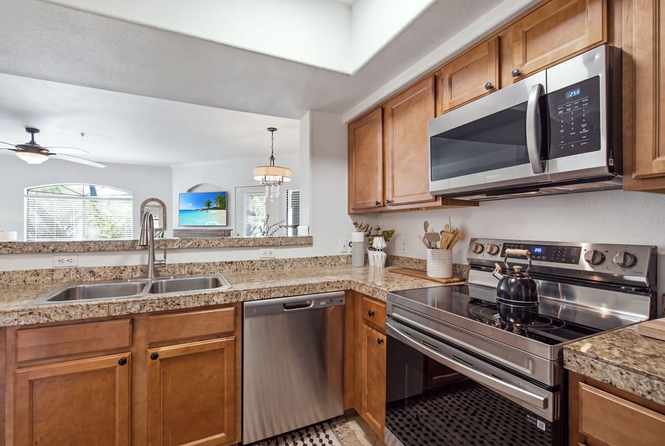 Cook up a feast in the well-appointed kitchen, featuring granite counters, stainless appliances, and a Keurig for easy mornings.