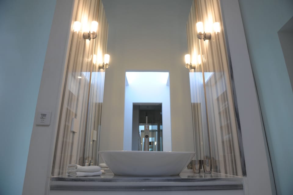 Suite | Bathroom | Designer toiletries, hair dryer, bathrobes, slippers