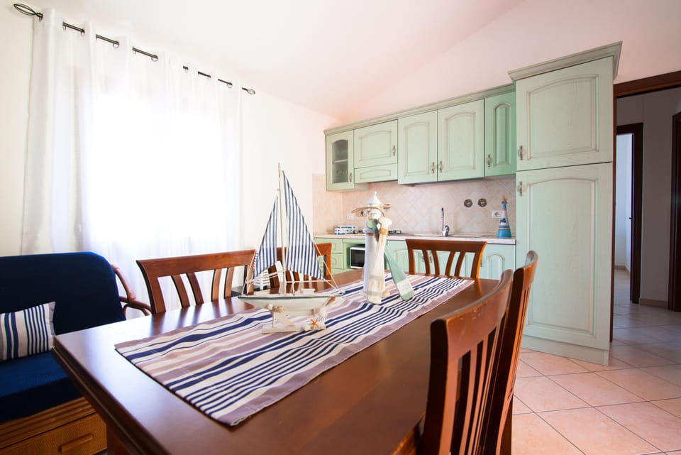 Apartment, 2 Bedrooms (Trilocale Boutique) | Private kitchen | Full-size fridge, microwave, stovetop, dishwasher