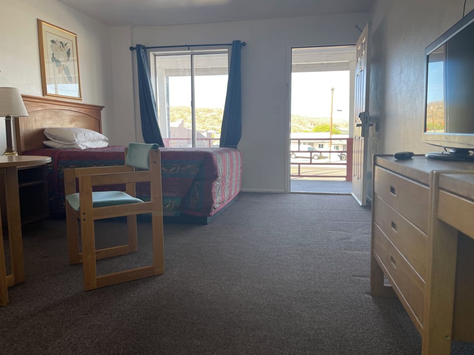 Standard Room, 1 Queen Bed - Second Floor | Living area | Flat-screen TV
