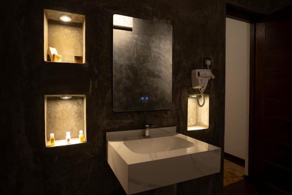 Deluxe Double Room, Patio | Bathroom | Shower, hair dryer, towels, soap