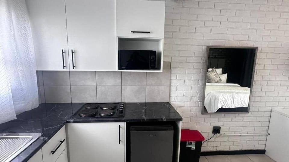 Mini-fridge, microwave, stovetop, cookware/dishes/utensils