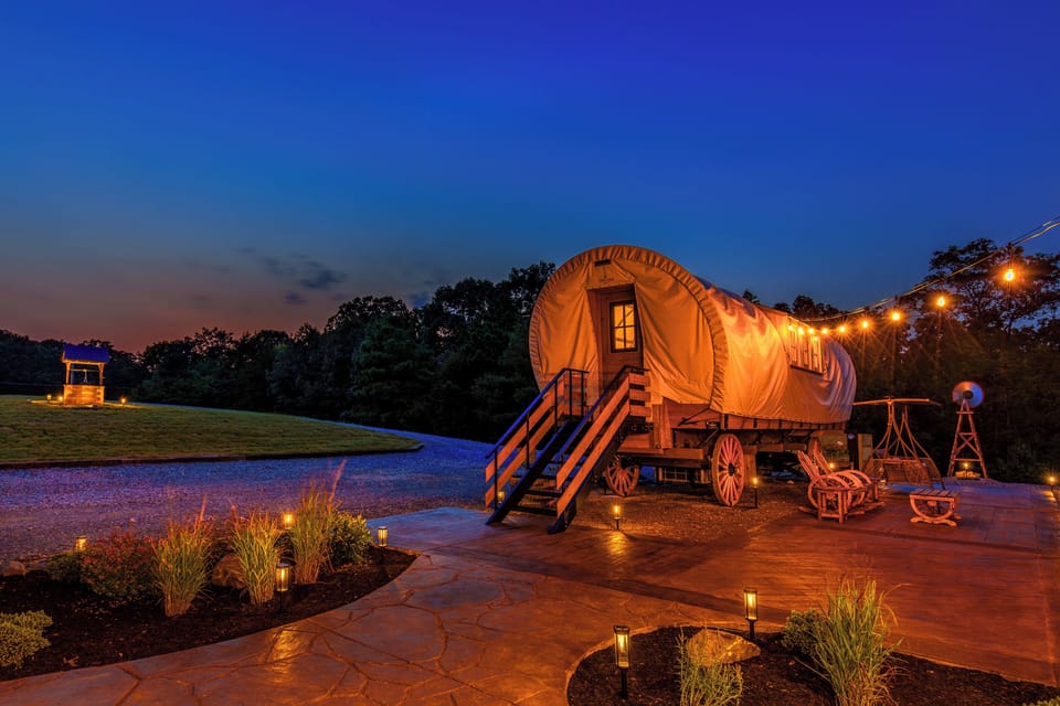 Golden evening lights, private patio space, and a one-of-a-kind romantic wagon escape.