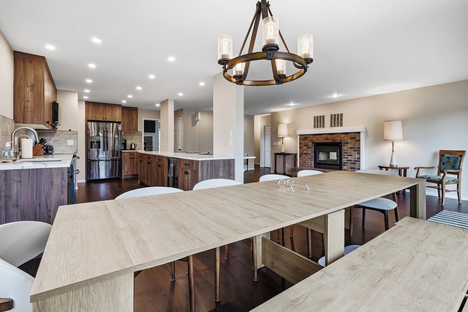 Bright dining space with beautiful views and natural light.   (Note: For liability reasons, fireplace is not for guest use)