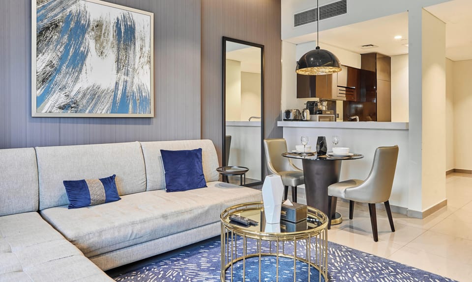 Superior Apartment, Balcony, Bay View | Living area | 55-inch flat-screen TV with digital channels