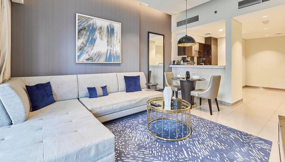 Superior Apartment, Balcony, Bay View | Living area | 55-inch flat-screen TV with digital channels