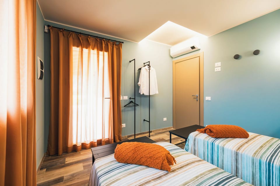 Deluxe Apartment, 2 Bedrooms, Air conditioning, Partial Sea View | Blackout drapes, WiFi (free), individually decorated
