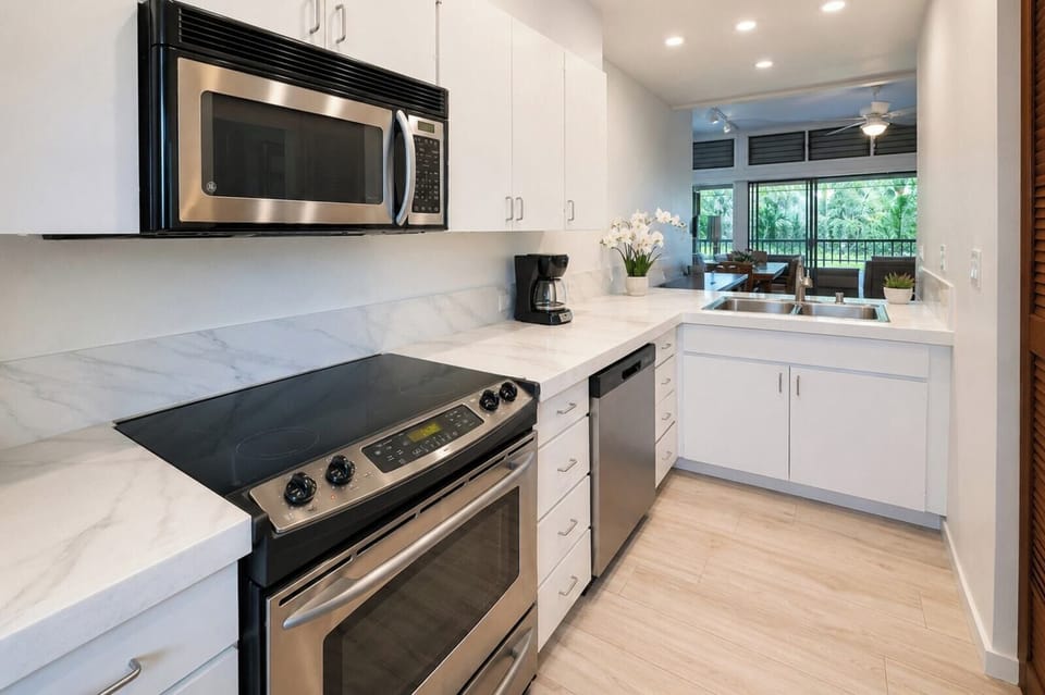 Full kitchen with stainless appliances and stone counters KRV-2522