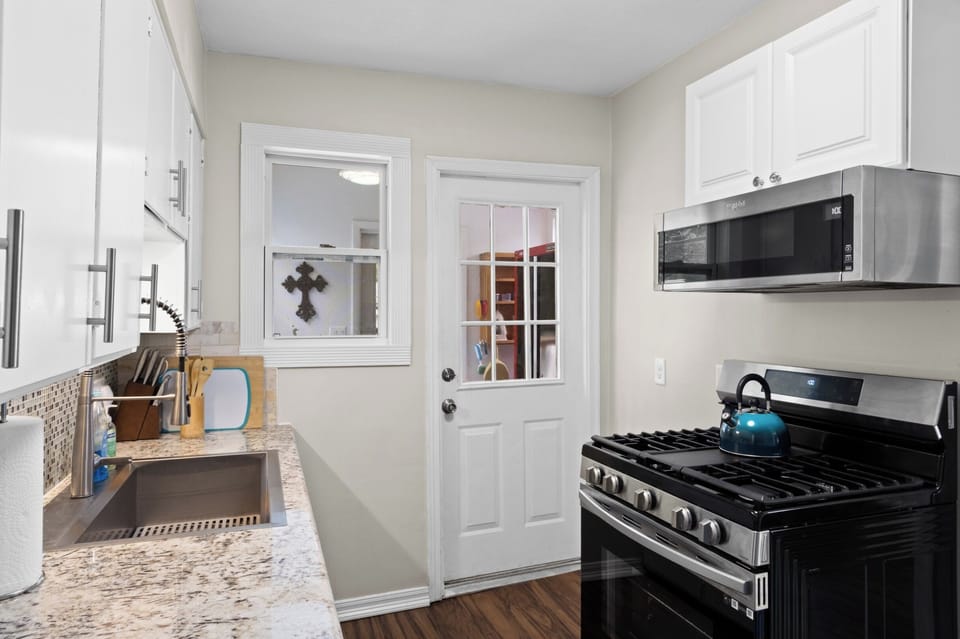 Cook with ease on the gas range and stainless appliances, with granite counters and a deep sink to prep the day's fresh catch.