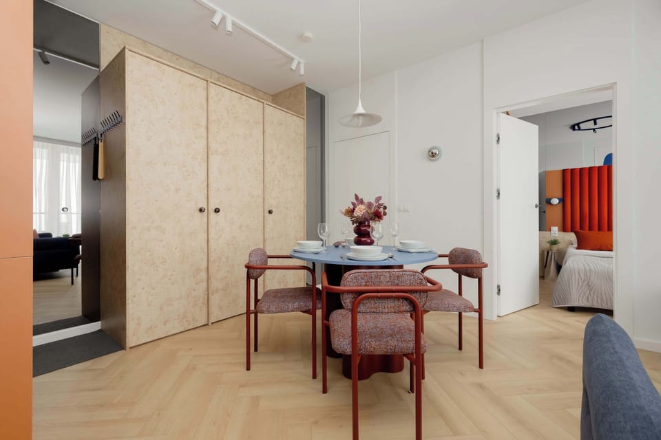 The living room has a modern look and comfortable furniture.