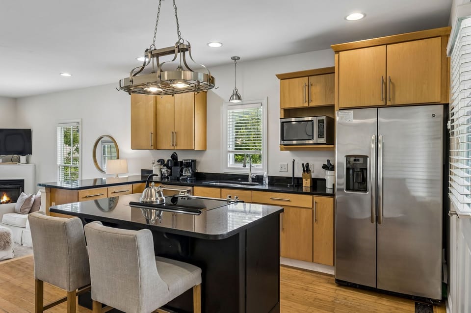 Kitchen: Cook and gather in this bright, well-equipped kitchen featuring ample counter space, modern appliances, and everything needed for easy meals during your stay.