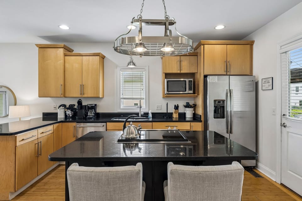 Kitchen: Cook and gather in this bright, well-equipped kitchen featuring ample counter space, modern appliances, and everything needed for easy meals during your stay.
