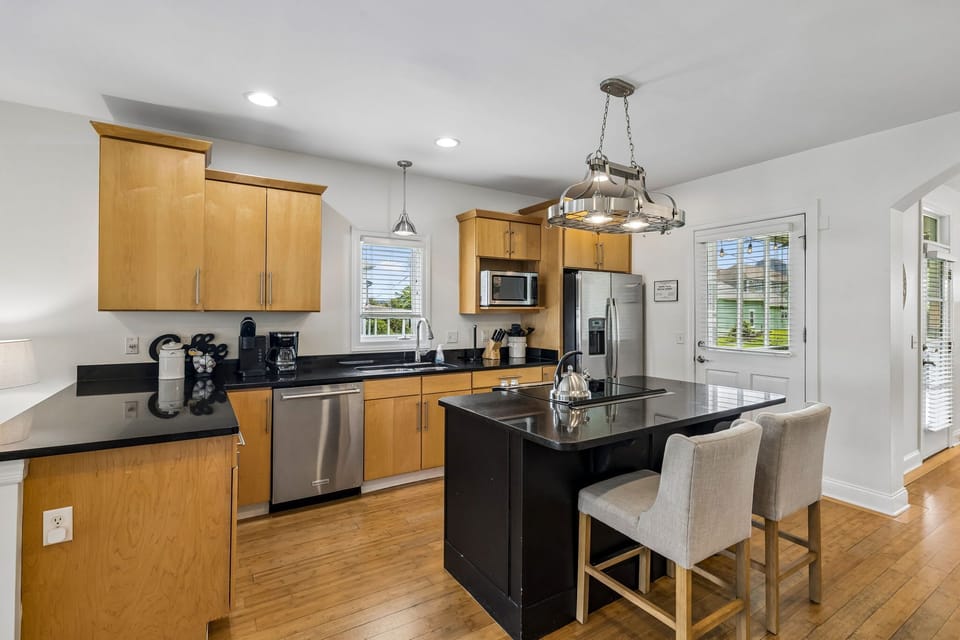 Kitchen: Cook and gather in this bright, well-equipped kitchen featuring ample counter space, modern appliances, and everything needed for easy meals during your stay.