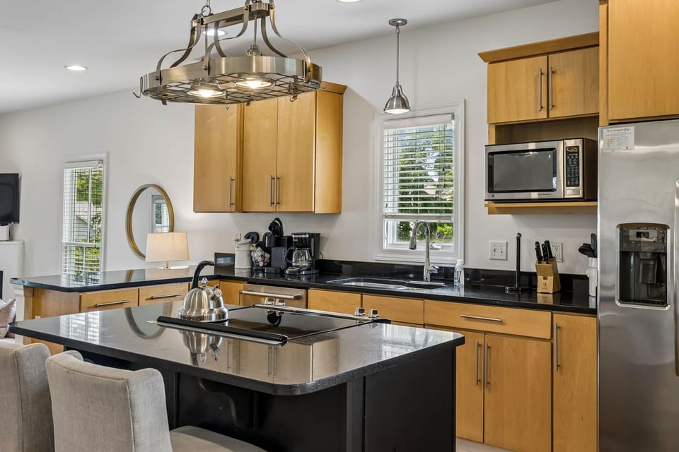 Kitchen: Cook and gather in this bright, well-equipped kitchen featuring ample counter space, modern appliances, and everything needed for easy meals during your stay.