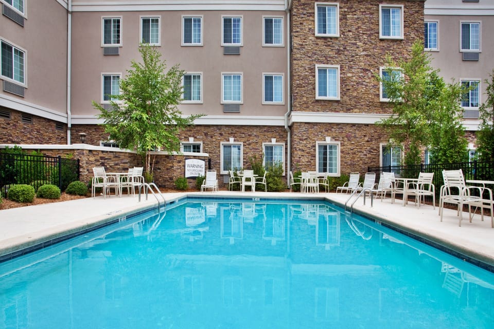 Take a refreshing dip in the pool, or relax in a chair under the serene atmosphere.