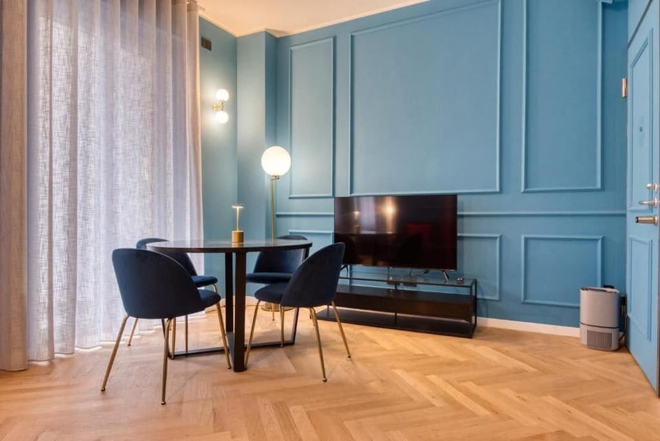 Deluxe Apartment, Balcony, City View | Living area | 50-inch Smart TV with cable channels